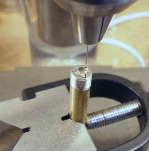 Figure 3: Nut used as jig to drill holes.